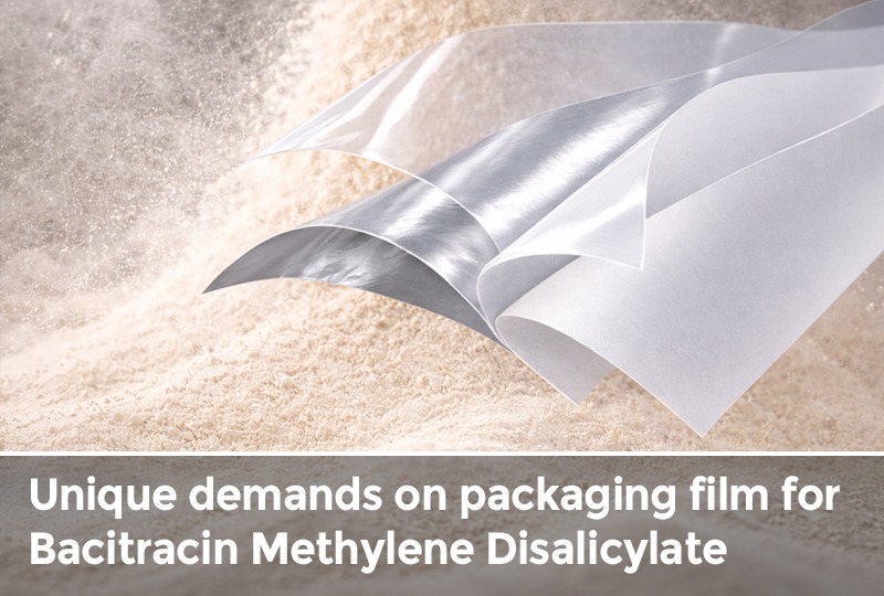 Flexible multilayer packaging film displayed over fine powder used for Bacitracin Methylene Disalicylate feed additive packaging.
