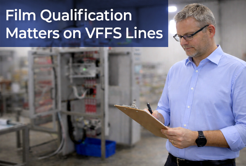 Engineer inspecting VFFS packaging film performance on a production line